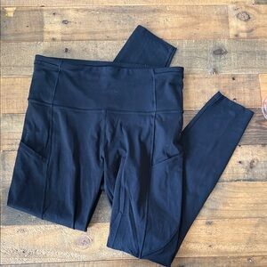 Lululemon - black leggings with side pockets and ankle detail